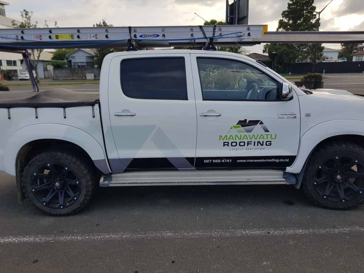 Manawatu Roofing team working on a long-run roof